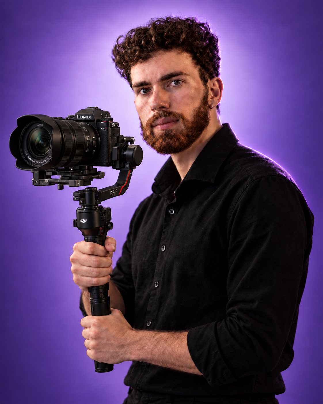 Alexander holding a Lumix camera on a DJI RS 5 gimbal